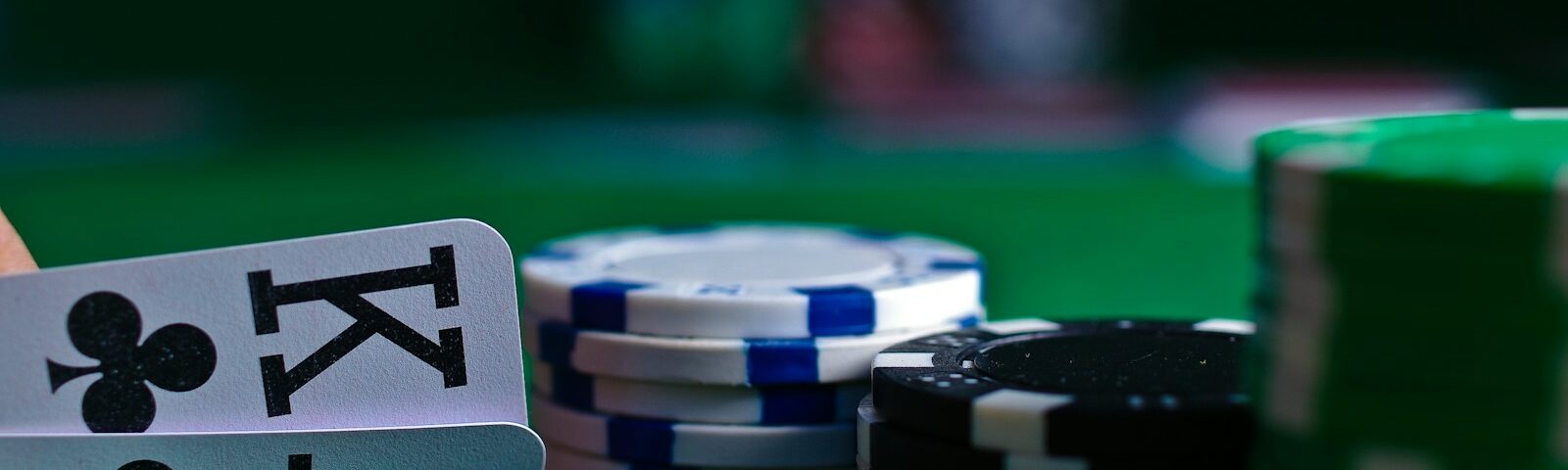 white and black dice on green table